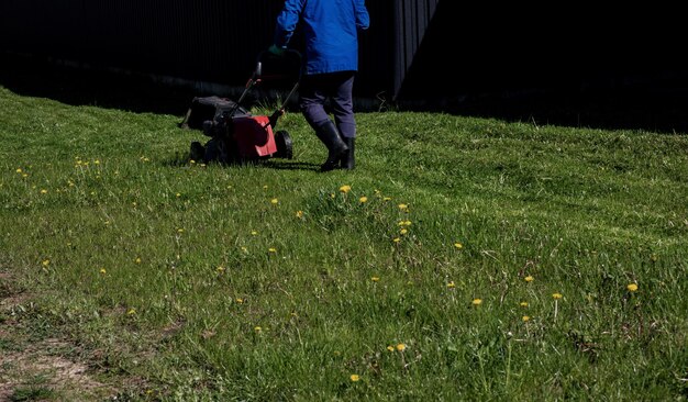 Mowing grass with an electric lawn mower