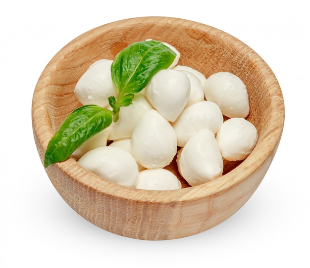 Mozzarella cheese and basil in bowl on white space