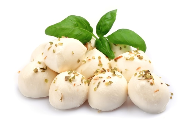 Mozzarella isolated on white with basil.