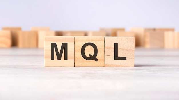 MQL word concept written on wooden cubes or blocks on a light background