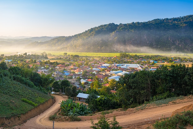 Muang Long village in the golden triangle, Luang Namtha North Laos near China Burma Thailand, small town in river valley with scenic mist and fog