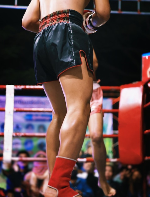 Muay Thai fighting on the boxing ring