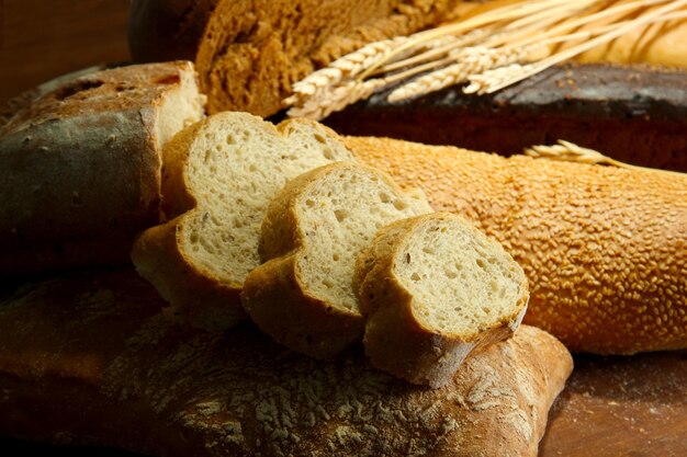 Much bread on wooden board