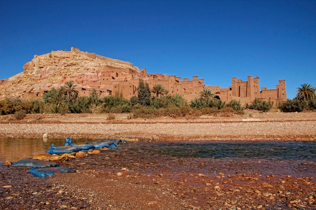 The mud houses on the mountain of Ksar Ait Ben Haddou photo from the river Morocco