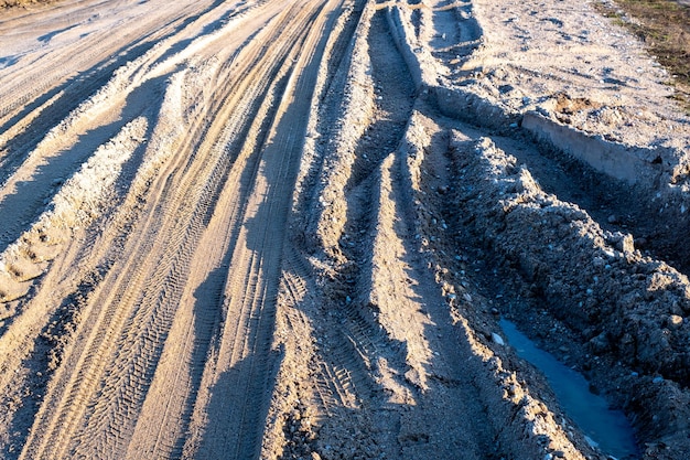 Muddy road on a dirt road outside the city