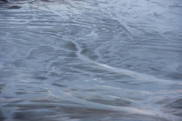 Muddy waters in a decantation pond Toxic residuals from a copper mine decating in a settling basin Geological industrial mining landscape Geamana Rosia Montana Romania