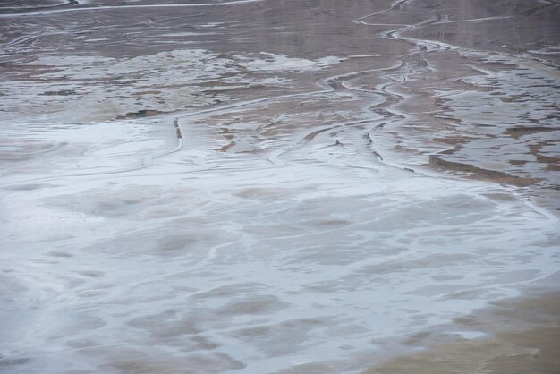 Photo muddy waters in a decantation pond toxic residuals from a copper mine decating in a settling basin