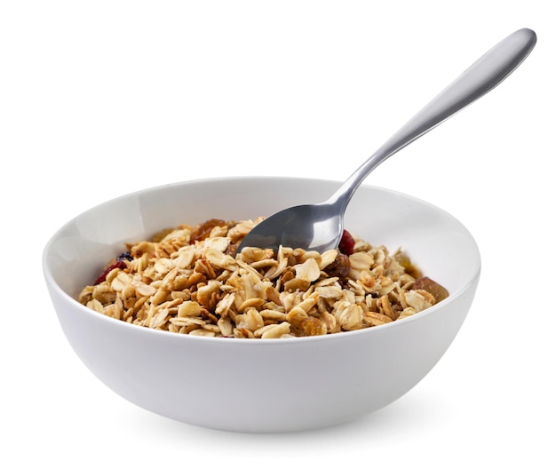 Photo muesli in a plate with a spoon on a white background isolated