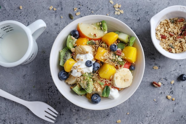 Muesli with fruits served in bowl