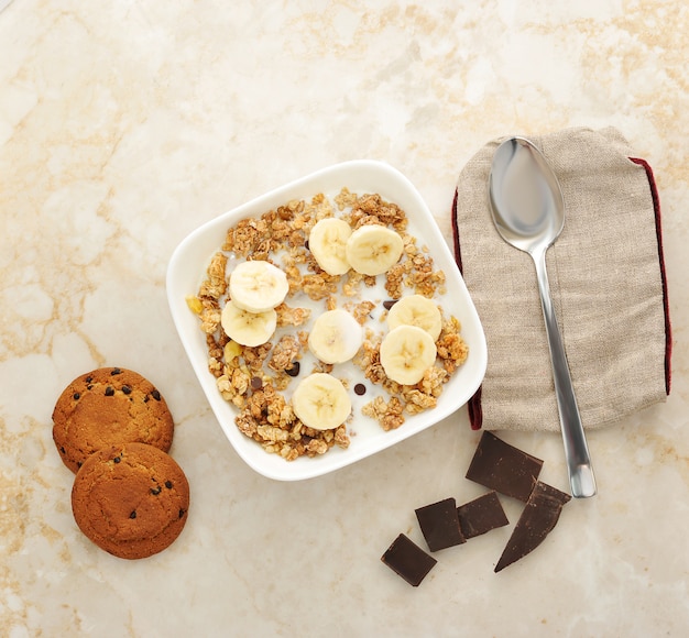 Muesli with milk, banana and chocolate