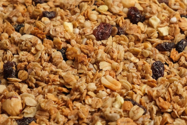 Muesliachtergrond. Zelfgemaakte muesli vulling volledig frame. Bovenaanzicht, close-up. Droge Muesli Mix Stapel