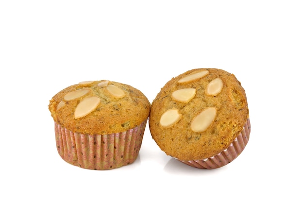 Muffin cake with almond on white background