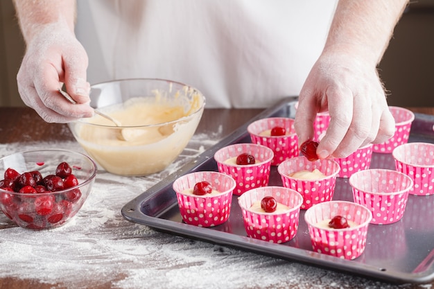 Muffin dough is poured into the mold