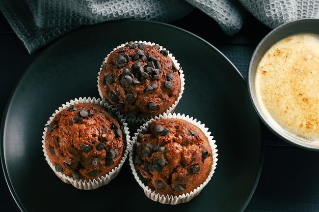 Muffins chocolate cupcakes with cappuccino