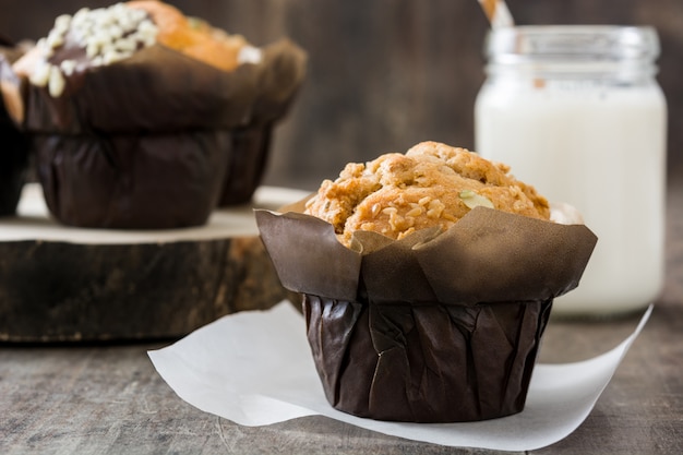 Photo muffins on a rustic wood table copy space