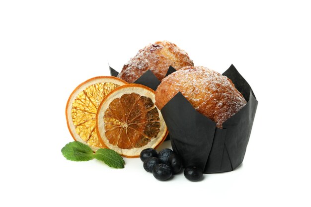 Muffins with blueberry, oranges and mint isolated on white background.