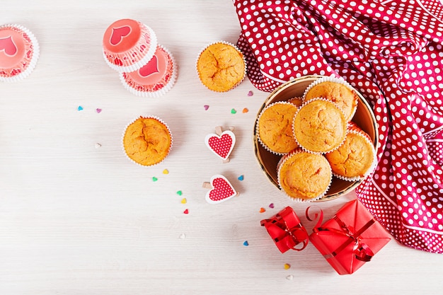 Muffins with pumpkin. Cupcakes with Valentine's Day decor. Flat lay. Top view.