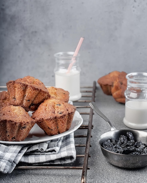 muffins with raisins on gray textured concrete background