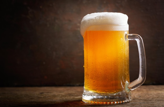 Mug of beer on a wooden table