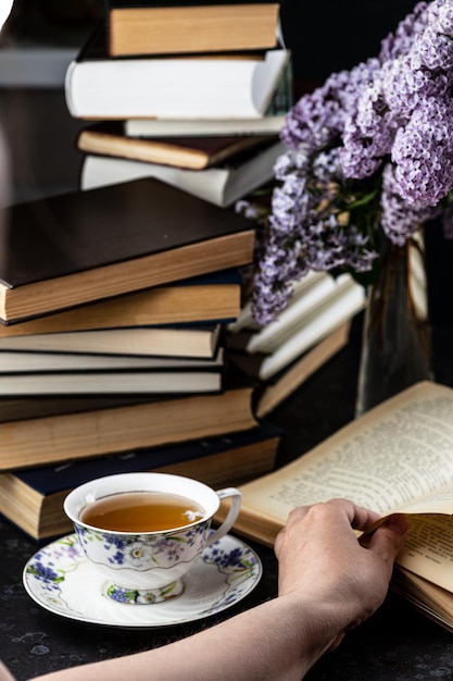 A mug and a bouquet of lilacs