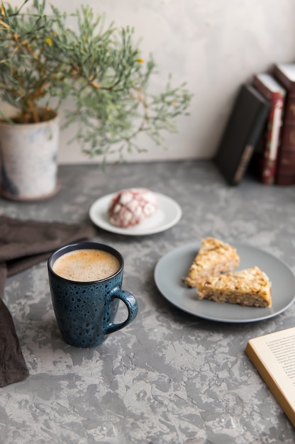 mug of coffee or cappuccino with two pieces of almond cake