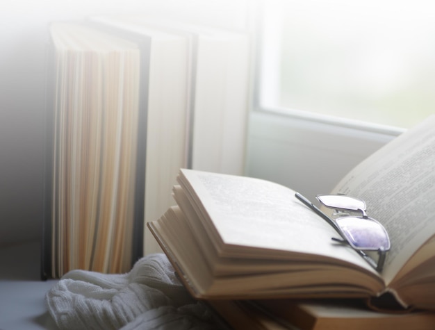 Mug of hot tea and books