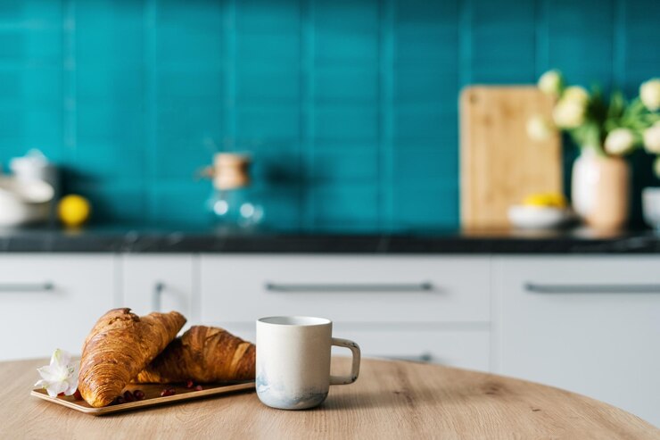 mug with drink and homemade pastry on table at home