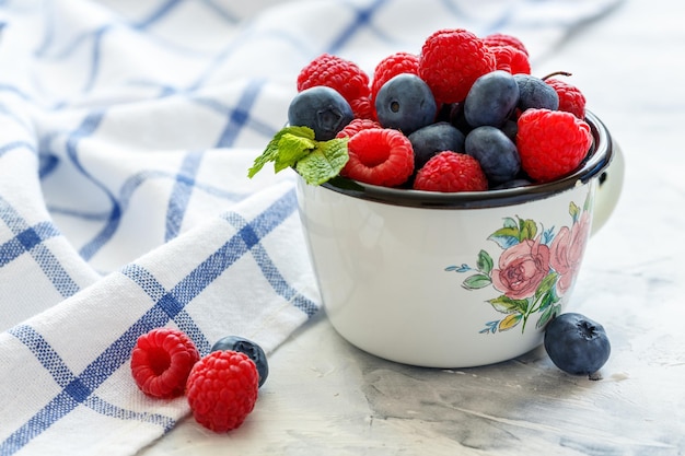 Mug with fresh berries