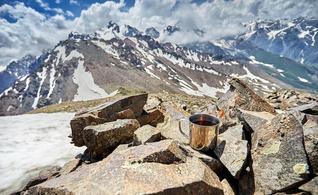 Mug with tea in the mountains