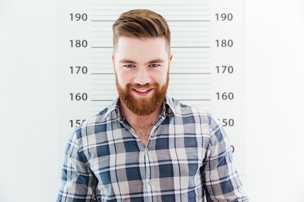 Photo mugshot of a happy man looking at camera