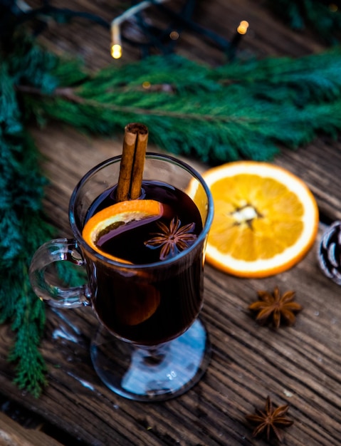 Mulled wine Christmas drink on wooden table