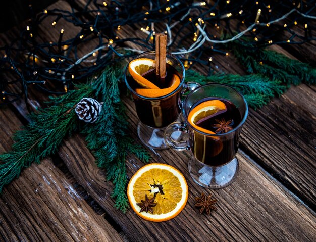 Mulled wine Christmas drink on wooden table