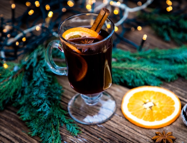 Mulled wine Christmas drink on wooden table