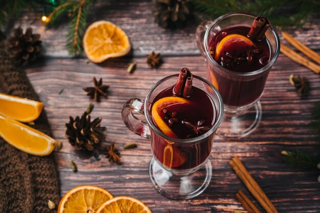 Mulled wine, Christmas hot drink with addition aromatic spices, citrus fruit