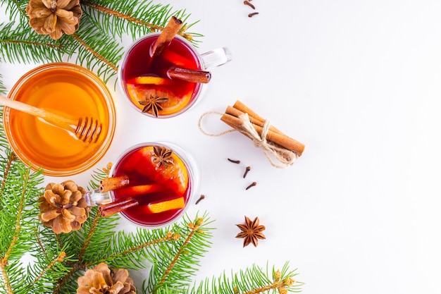 Mulled wine in glass mug with spices