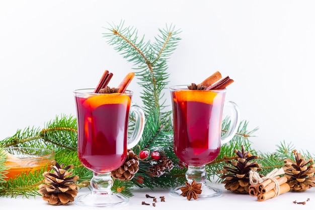 Mulled wine in glass mug with spices