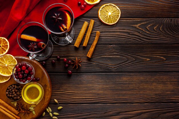 Mulled wine recipe ingredients for Christmas hot drink in glasses