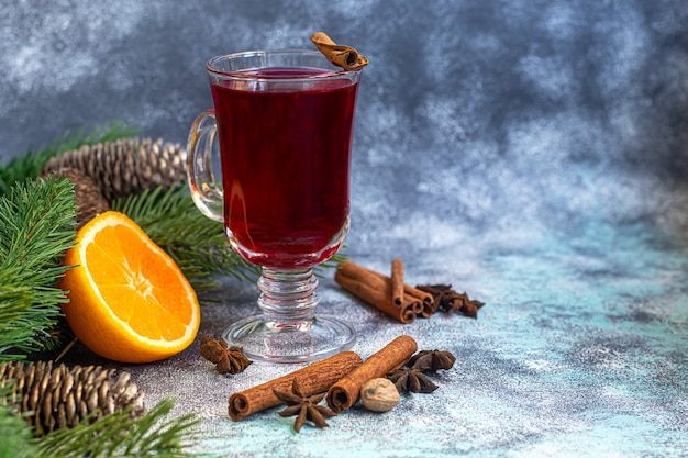 Mulled wine, a warming drink in a cup with spices