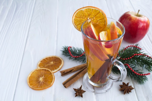 Mulled wine with apples, orange, cranberries and spices