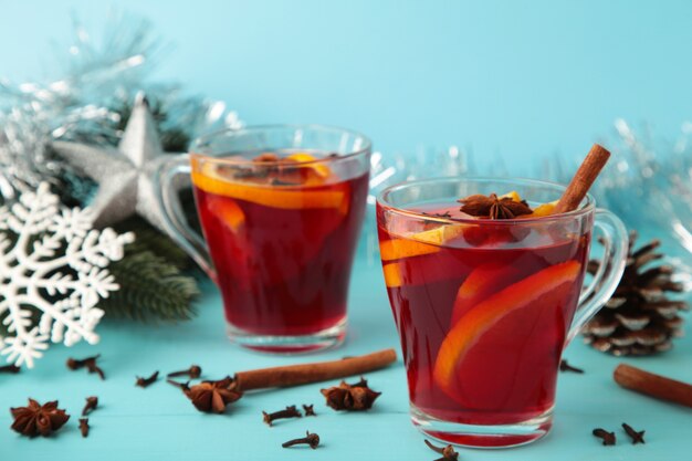Mulled wine with cinnamon and anise stars on blue background. Thanksgiving Day