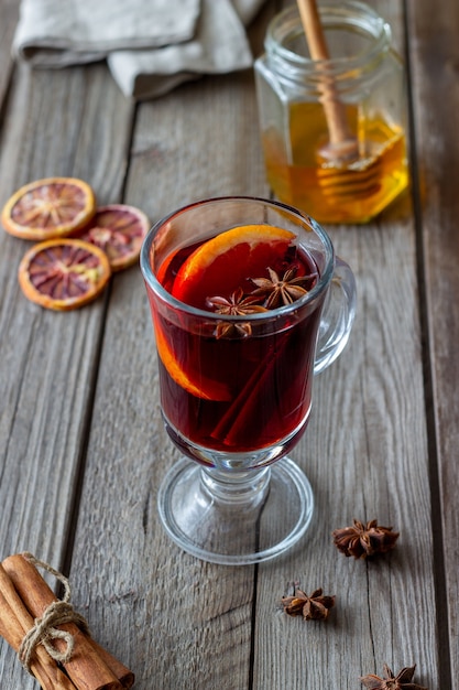 Mulled wine with cinnamon and orange. Hot drink. Winter. Recipe.