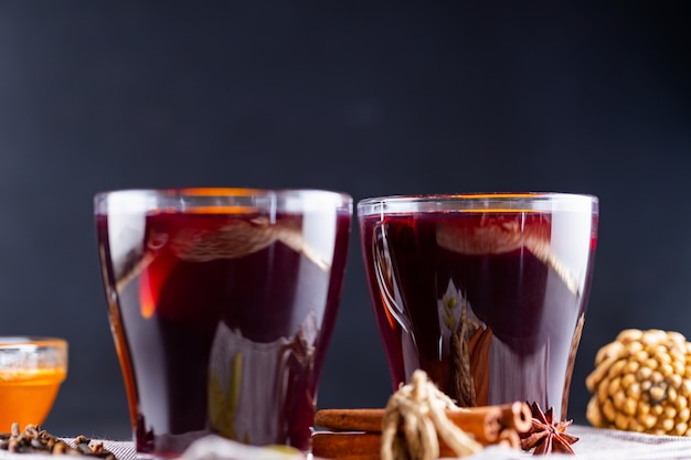 Mulled wine with orange and spices in cups