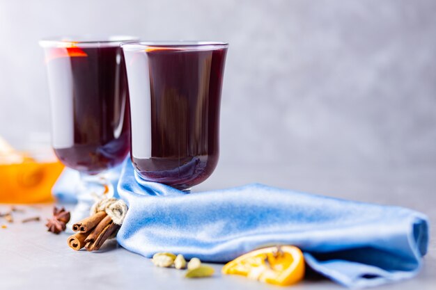 Mulled wine with orange and spices in cups