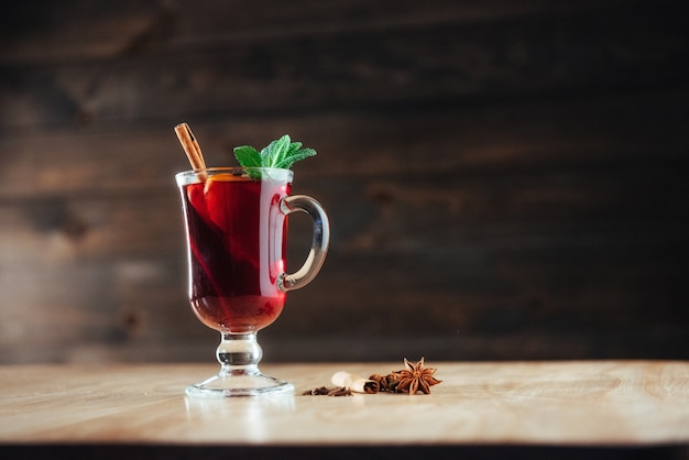 Mulled wine with slice of orange  spices. 