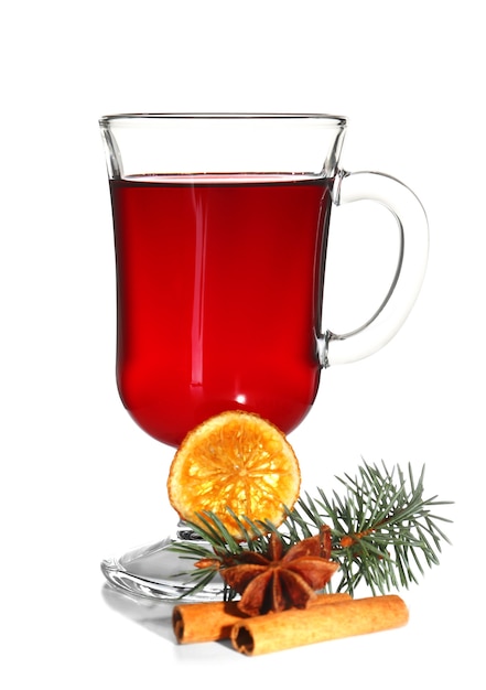 Mulled wine with spices on a table isolated on white surface