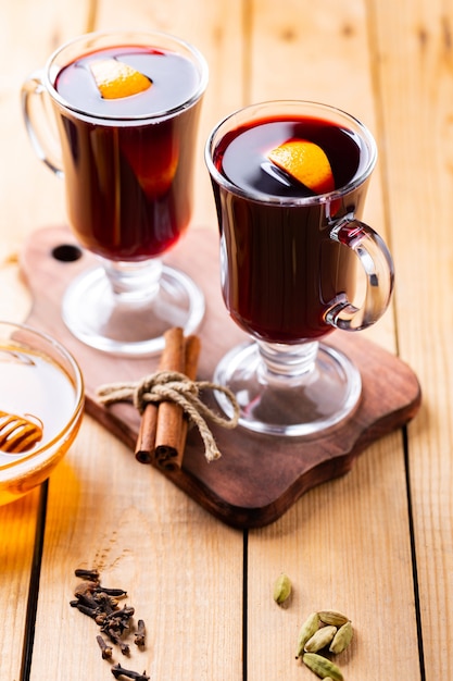 Mulled wine on a wooden boards.