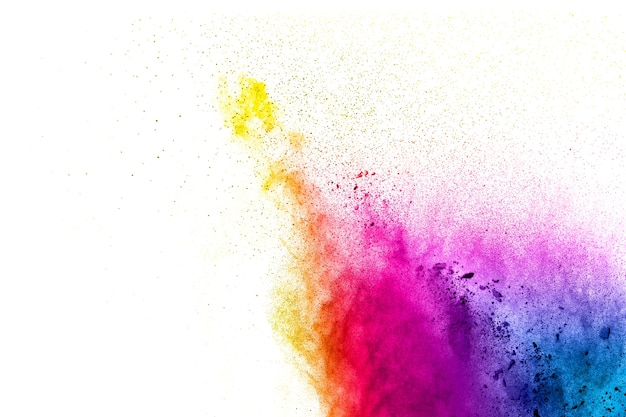 Multi color powder explosion on white background. Launched colorful particles splash on ba