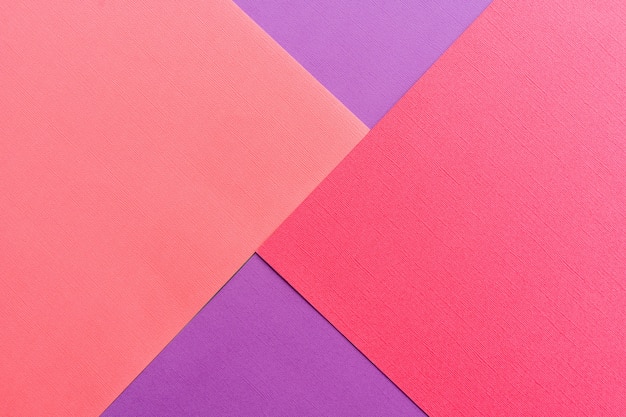 Multi colored abstract paper of pastel colors palette, with geometric shape, flat lay.