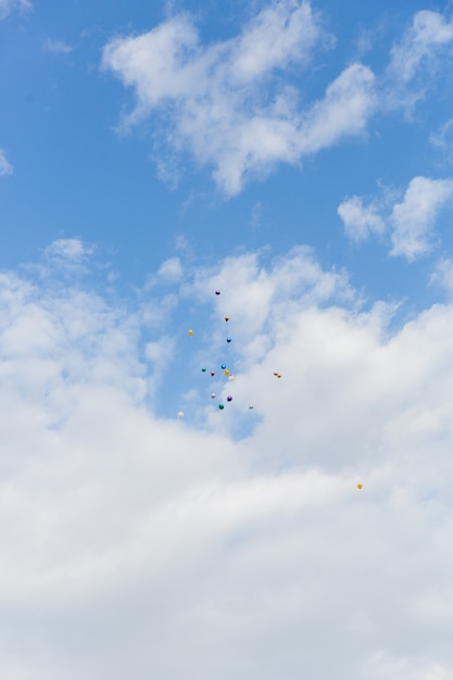 Multi-colored balls in the blue sky