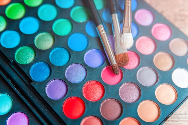 Multi colored beauty products on table